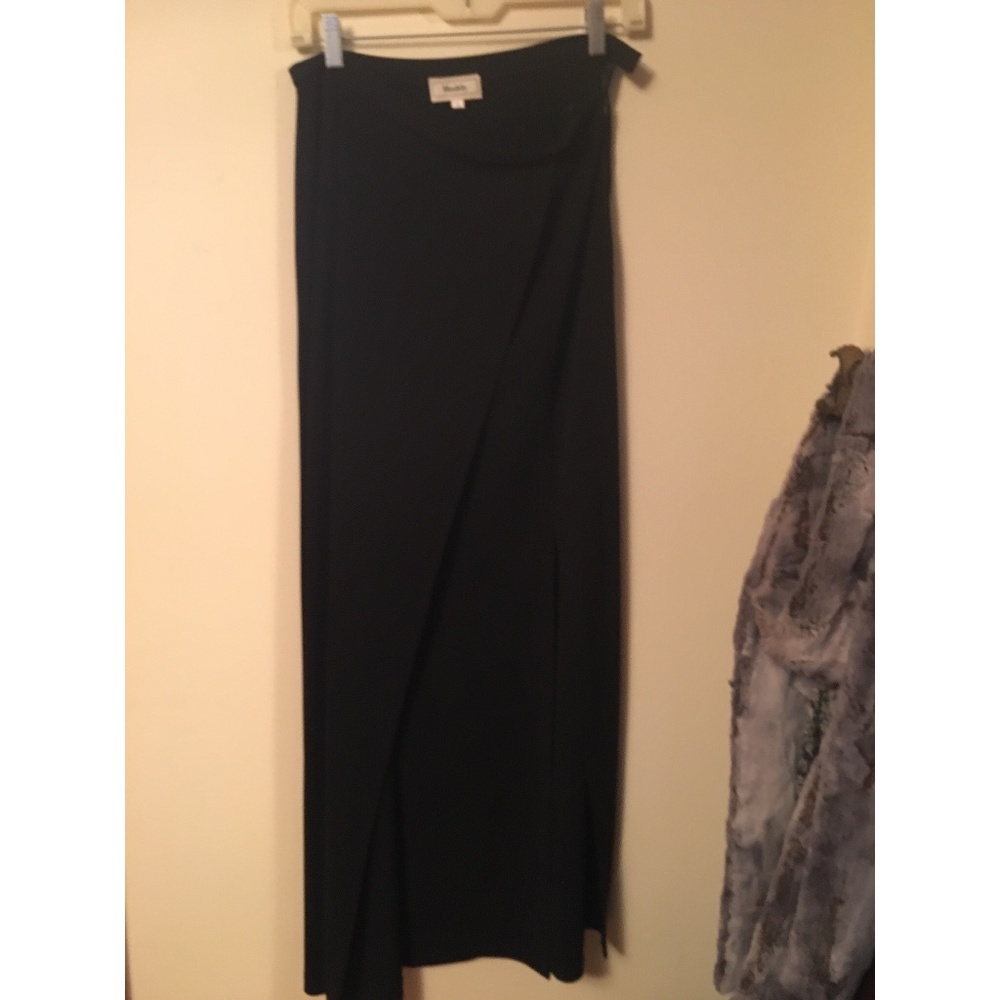 Designer black faux wrap skirt with slit.